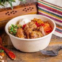 Mini Lamb · Slow braised in a tomato based broth with traditional Mediterranean herbs and spices until i...