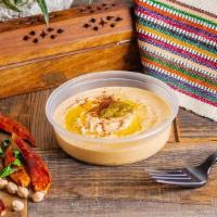 Spicy Hummus · Crushed jalapenos and spices are added to our classic hummus for some flavorful heat.
