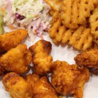 Spicy Chicken Nuggets · Chicken breast nuggets in our hot oil served with coleslaw and pickles on the side and choic...
