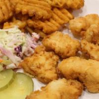 Chicken Nuggets · Chicken breast nuggets served with coleslaw and pickles on side and choice of sauces. Comes ...