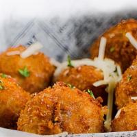 Mashed Potato Bites · Creamy house made mashed potato balls filled with cheddar, pepper jack and parmesan cheeses ...