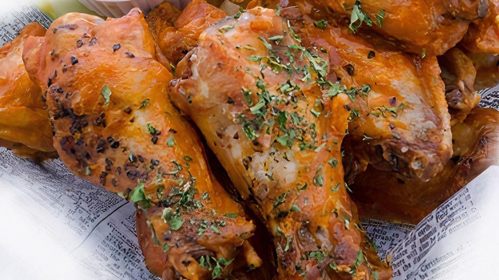 Buffalo Chicken Wings · 1 dozen Classic style wings in your choice of sauce (mild, medium, hot, nitro, or garlic parmesan) with celery sticks, carrot sticks, and fries. Blue cheese or ranch dressing.