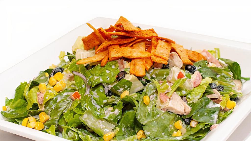 Southwestern Chicken Salad · Chopped romaine, grilled or crispy chicken, diced tomatoes, sliced red onions, sweet corn, black beans, and crispy tortilla strips tossed with a creamy jalapeno ranch dressing
