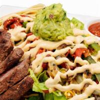 Steak Fajita Salad · Charred Filet, Romaine, diced tomatoes, cheddar jack cheese, grilled red and green bell pepp...