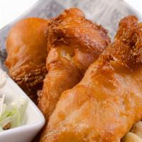 Beer Battered Fish & Chips · Hand battered cod filets, with fries and coleslaw, served with a house made lemon tartar sauce