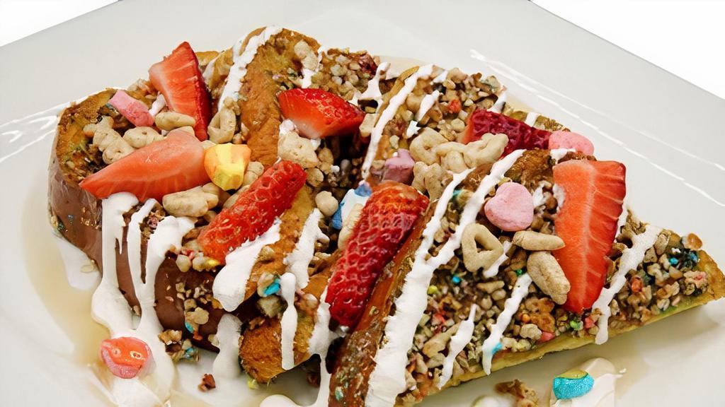 Luck Of The Irish French Toast · Battered brioche bread crusted in Lucky Charms cereal and topped with Lucky Charms frosting and macerated berries. Served with house-made Irish whiskey maple syrup