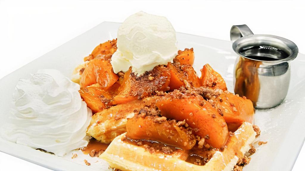 Peach Cobbler Waffle · Belgian waffle with roasted peach cobbler filling topped with cobbler crumble and whipped cream.