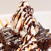 Chocolate Brownie Sundae · An in house baked brownie served warm with vanilla ice cream, and drizzled with chocolate an...