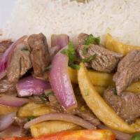 Lomo Saltado · Beef sautéed with onions, tomatoes, and a light sauce served with french fries and white rice.