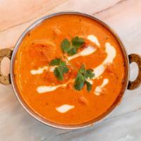 Chicken Tikka Masala · Chicken breast cooked in rich creamy tomato & Onion Sauce. It has all delicious Indian spice...
