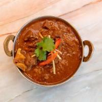Goat Curry · Goat cooked in a moderately spicy sauce. Gluten-Free.