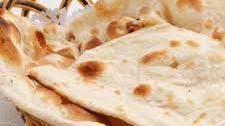 Plain Naan (No Butter) · Warm soft, puffy bread bakes in a special tandoor (clay oven) without butter on top. Vegetar...