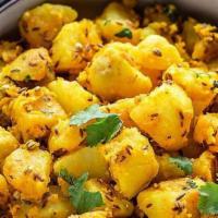 Jeera Aloo · Potatoes cooked with cumin & herbs.