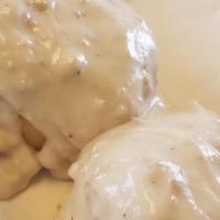 Biscuits & Gravy · Two soft biscuits covered in sawmill sausage gravy.