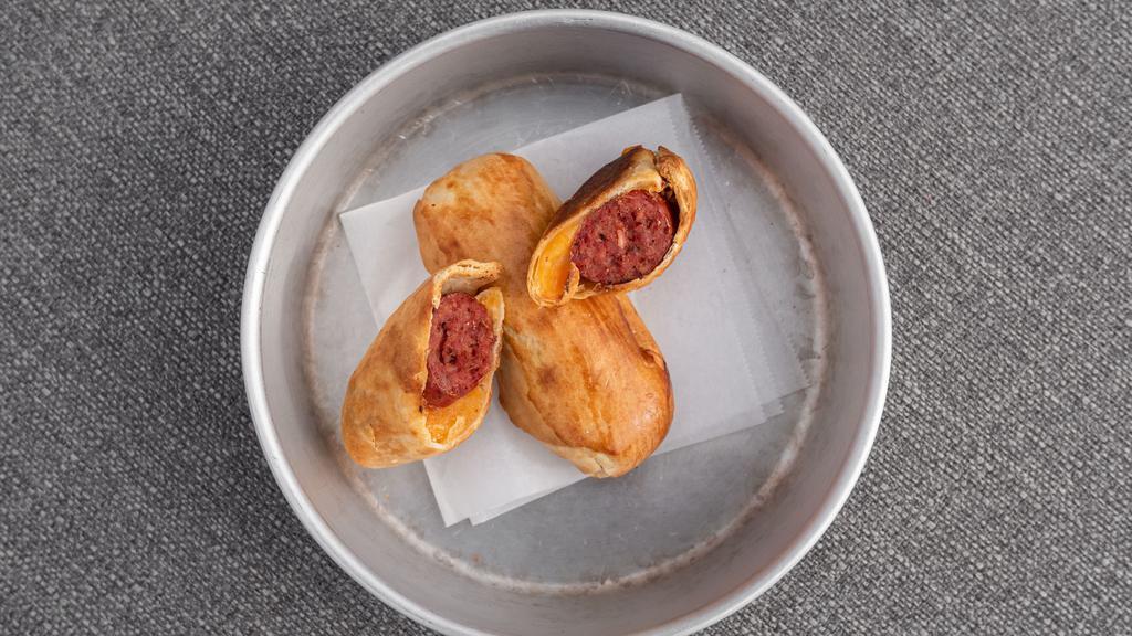 Texas Sausage Kolache · Genuine Texan sausage and cheddar cheese in a home made bread pocket.