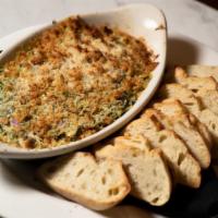 Spinach Artichoke Dip · Bubbly blend of melted cheeses, spinach and artichokes, served with toasted sourdough baguet...