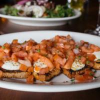 Betta Bruschetta · Grilled focaccia bread, roma tomatoes, goat cheese, onions,
olive oil and basil
