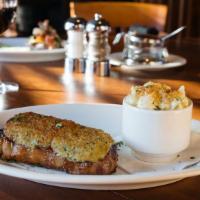 Parmesan Crusted New York Strip · A flavorful steak topped with johnny’s own parmesan butter crust