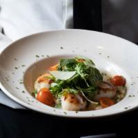 Scallops And Arugula Risotto · Seared scallops, lemon butter, cherry tomatoes, arugula and shaved Asiago cheese, served ove...
