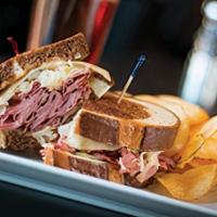 Chophouse Reuben · Shaved Pastrami, Swiss cheese, sauerkraut and Thousand Island dressing on grilled artisan ma...