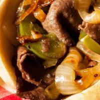 Deluxe Cheesesteak · Steak or Chicken w/bell peppers, grilled onions & melted cheese