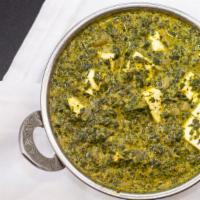 Sag Paneer · Gluten free. Creamy spinach cooked with home made cheese and spices.