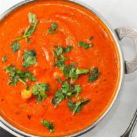 Chicken Tikka Masala · Gluten free. Breast meat barbecued in tandoor oven, then cooked with garlic, ginger, tomatoe...