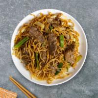 Beef Lo Mein · Pan-fried beef, steamed rice, eggs, peas, and green onions.