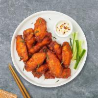 Spicy Chicken Wings · Breaded and fried chicken wings with spicy sauce.
