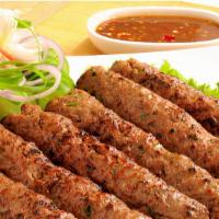 Beef Seekh Kabob · Minced beef mixed with onion and herbs roasted on skewers. Served with a side of white rice ...