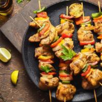 Chicken And Beef Seekh Kabob · Chicken and beef minced, mixed with onion and herbs, roasted on skewers. Served with a side ...