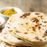 Naan · Fresh White flour leavened bread, baked to perfection.