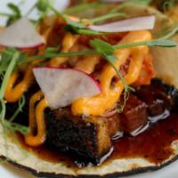 Pork Belly Tacos · Three corn tortillas, Traeger smoked pork belly, potato salad aioli, apple slaw, pickled red...