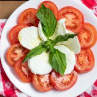 Insalata Caprese · Fresh mozzarella and tomatoes with extra virgin olive oil and fresh basil.