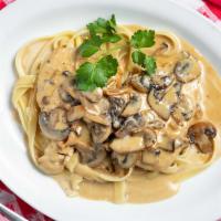 Marsala · Tender chicken breasts and mushrooms with Marsala wine and cream. Served over fettuccine.