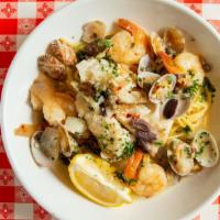 Frutti Di Mare · Wild cod, prawns, clams with olive oil, capers, garlic, onions and olives. Served over spagh...