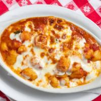 Gnocchi In Cassoula · Gnocchi with meat sauce and mozzarella.