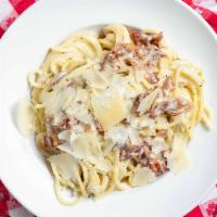 Spaghetti Alla Carbonara · Fresh cream, bacon, Parmesan, egg yolk and heavy black pepper.