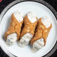 Cannoli · Slightly sweetened Ricotta and chocolate chips fill three delicious pastry shells.  A Sicili...