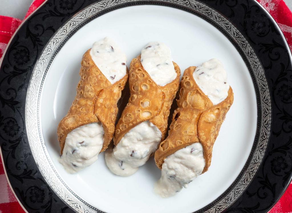 Cannoli · Slightly sweetened Ricotta and chocolate chips fill three delicious pastry shells.  A Sicilian favorite.