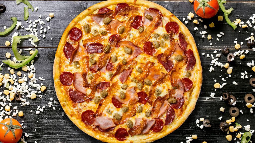 Meat Lover Madness Pizza · Gluten free dough topped with homemade pizza sauce, pepperoni, sausage, hamburger, bacon, ham, and mozzarella