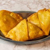 Aloo Samosa · This pastry of vedic origin is filled with delicately spiced potatoes and onion.