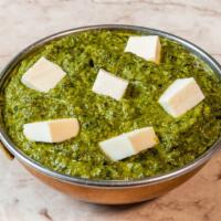 Saag Paneer  · Small cubes of homemade cheese cooked with a rich, indian creamed spinach. Gluten-free.
