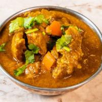Coconut Lamb Curry · Coconut milk, garlic, ginger, red chilies and indian spices are simmered with potatoes. Glut...