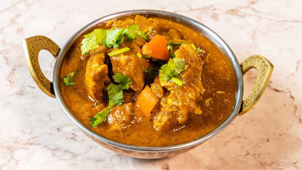 Coconut Lamb Curry · Coconut milk, garlic, ginger, red chilies and indian spices are simmered with potatoes. Gluten and Dairy free.
