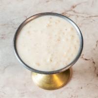 Kesari Kheer · Indian rice pudding is gently cooked with raisins and saffron.