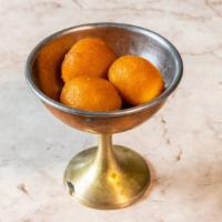 Gulab Jamun · Popular rose-flavored dumplings soaked in a sweet syrup.