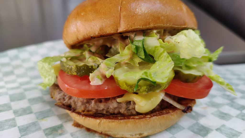 V-Ganimal · Impossible patty cooked in-n-out style, grilled onions, lettuce, tomato, pickles, special sauce served on a Portland French Bakery pub bun