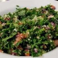 Tabbouli Salad · Lettuce, tomatoes, parsley, onion, mint, cracked wheat, fresh lemon juice and the best of vi...