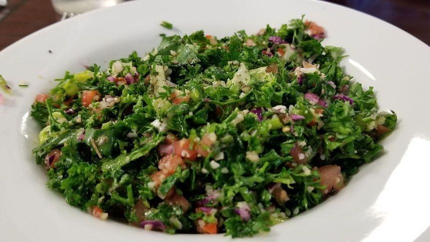 Tabbouli Salad · Lettuce, tomatoes, parsley, onion, mint, cracked wheat, fresh lemon juice and the best of virgin olive oil.